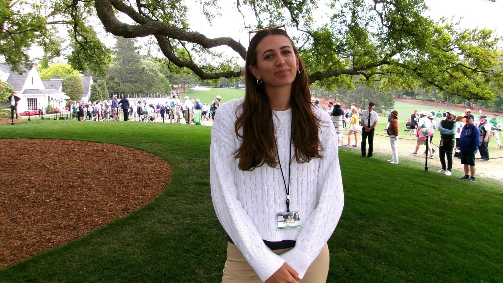 Gabby Herzig smiles on the golf course.